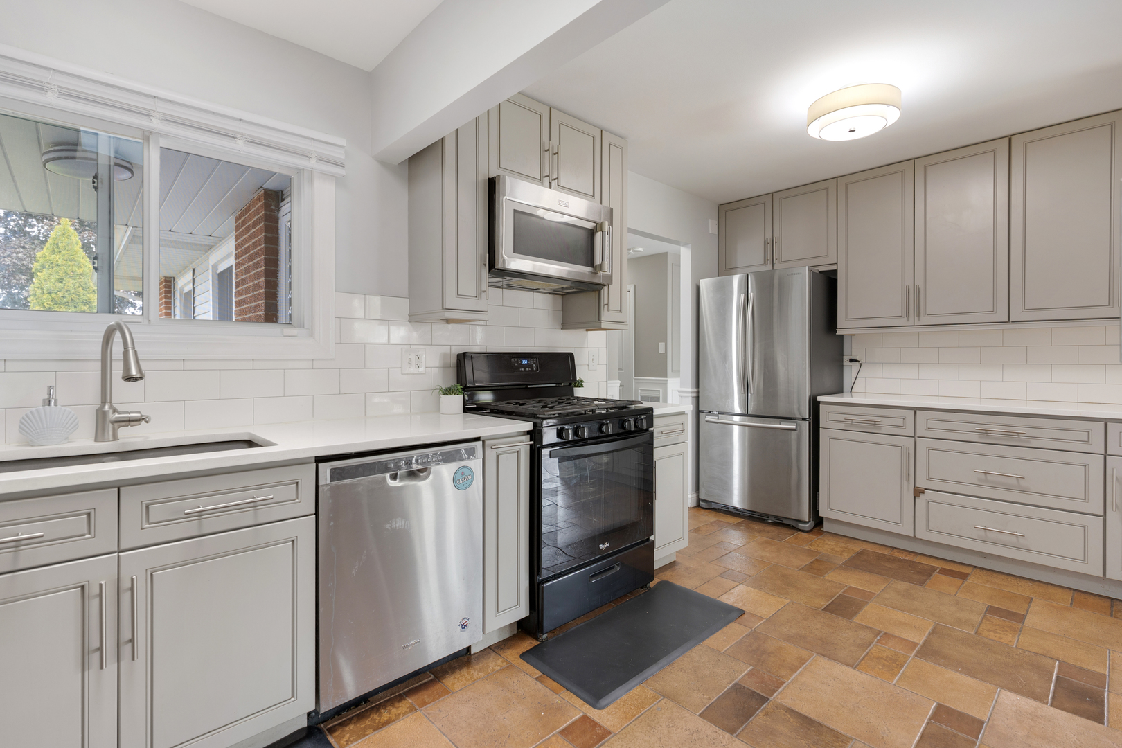1850 Pierce Road Hoffman Estates, IL 60169 - Photo 13 of 25 a kitchen with stainless steel appliances granite countertop a refrigerator stove and sink
