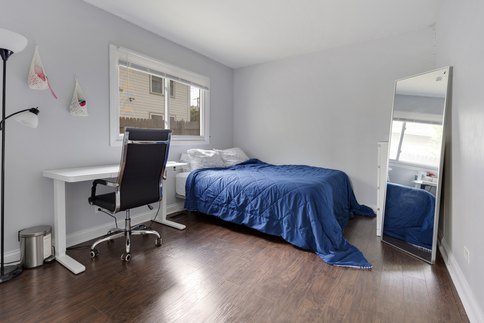 1850 Pierce Road Hoffman Estates, IL 60169 - Photo 17 of 25 a bedroom with a bed and a chair