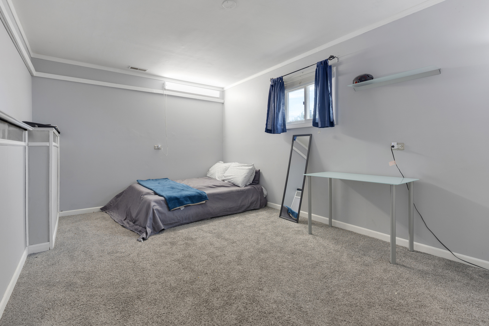 1850 Pierce Road Hoffman Estates, IL 60169 - Photo 19 of 25 a spacious bedroom with a bed and a lamp on the table