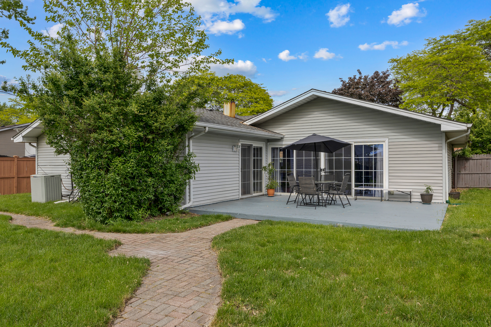 1850 Pierce Road Hoffman Estates, IL 60169 - Photo 20 of 25 a front view of house with a garden and patio