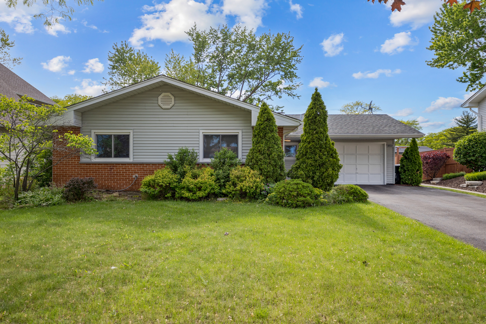 1850 Pierce Road Hoffman Estates, IL 60169 - Photo 2 of 25 a front view of house with yard and green space