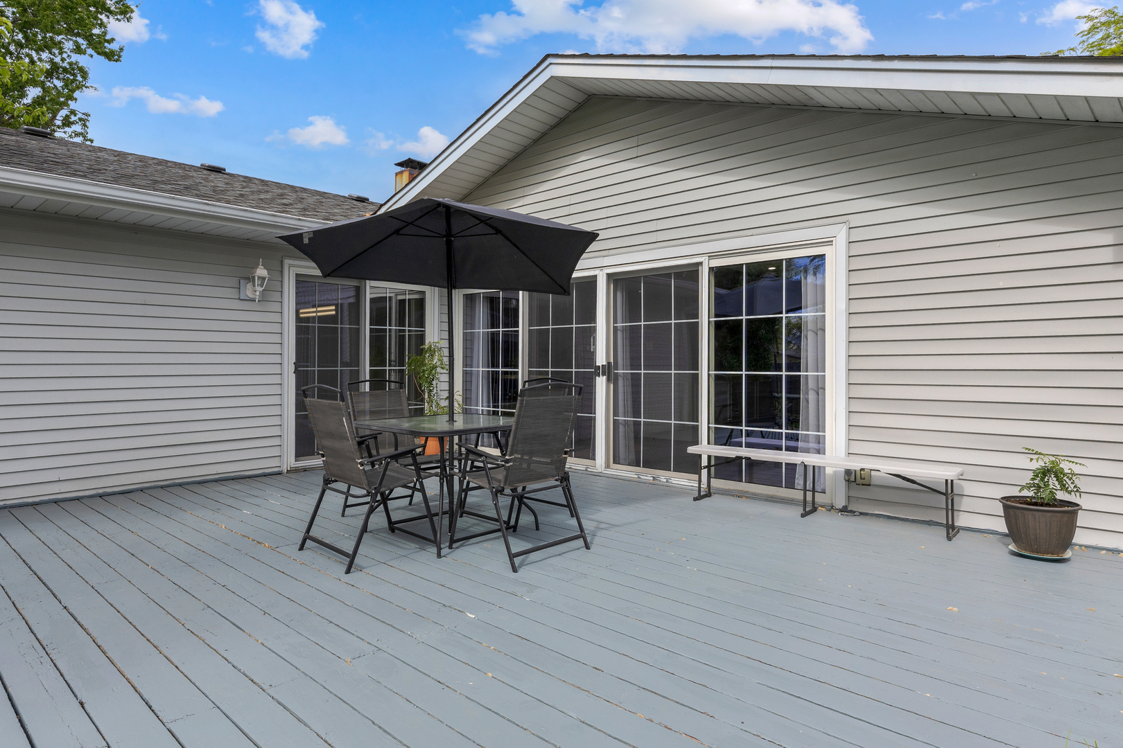 1850 Pierce Road Hoffman Estates, IL 60169 - Photo 22 of 25 a patio with wooden table and chairs