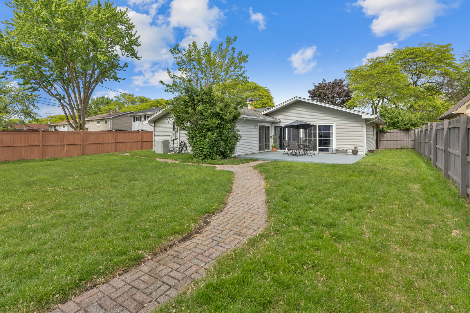 1850 Pierce Road Hoffman Estates, IL 60169 - Photo 23 of 25 a view of a house with a yard and potted plants