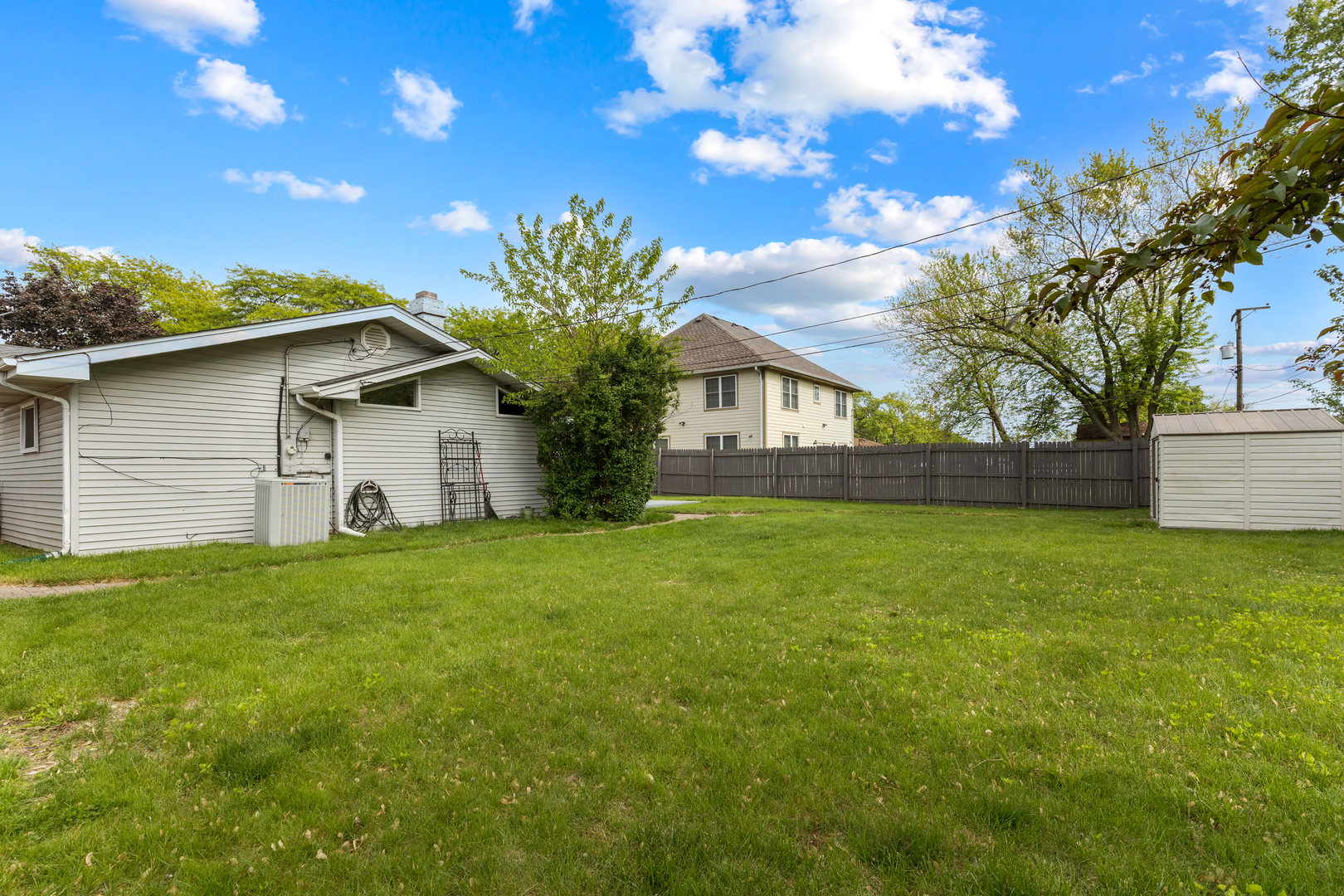 1850 Pierce Road Hoffman Estates, IL 60169 - Photo 25 of 25 a front view of house with yard and trees