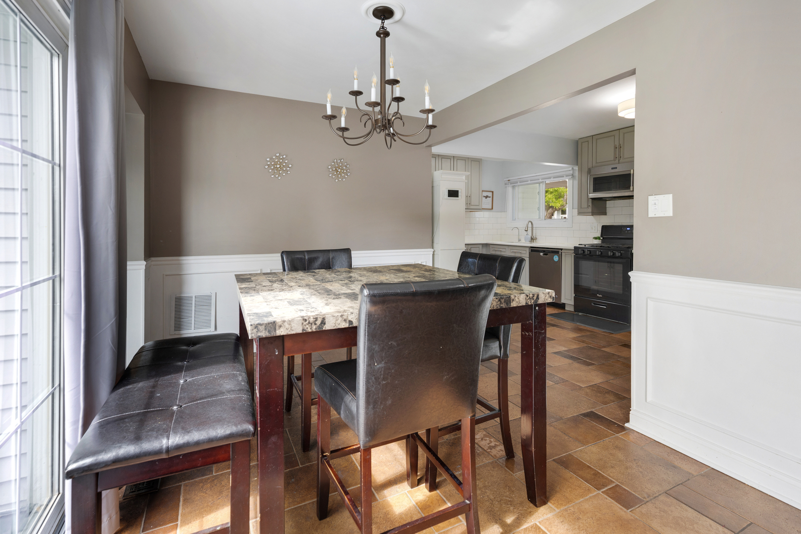 1850 Pierce Road Hoffman Estates, IL 60169 - Photo 8 of 25 a view of a dining room with furniture and chandelier