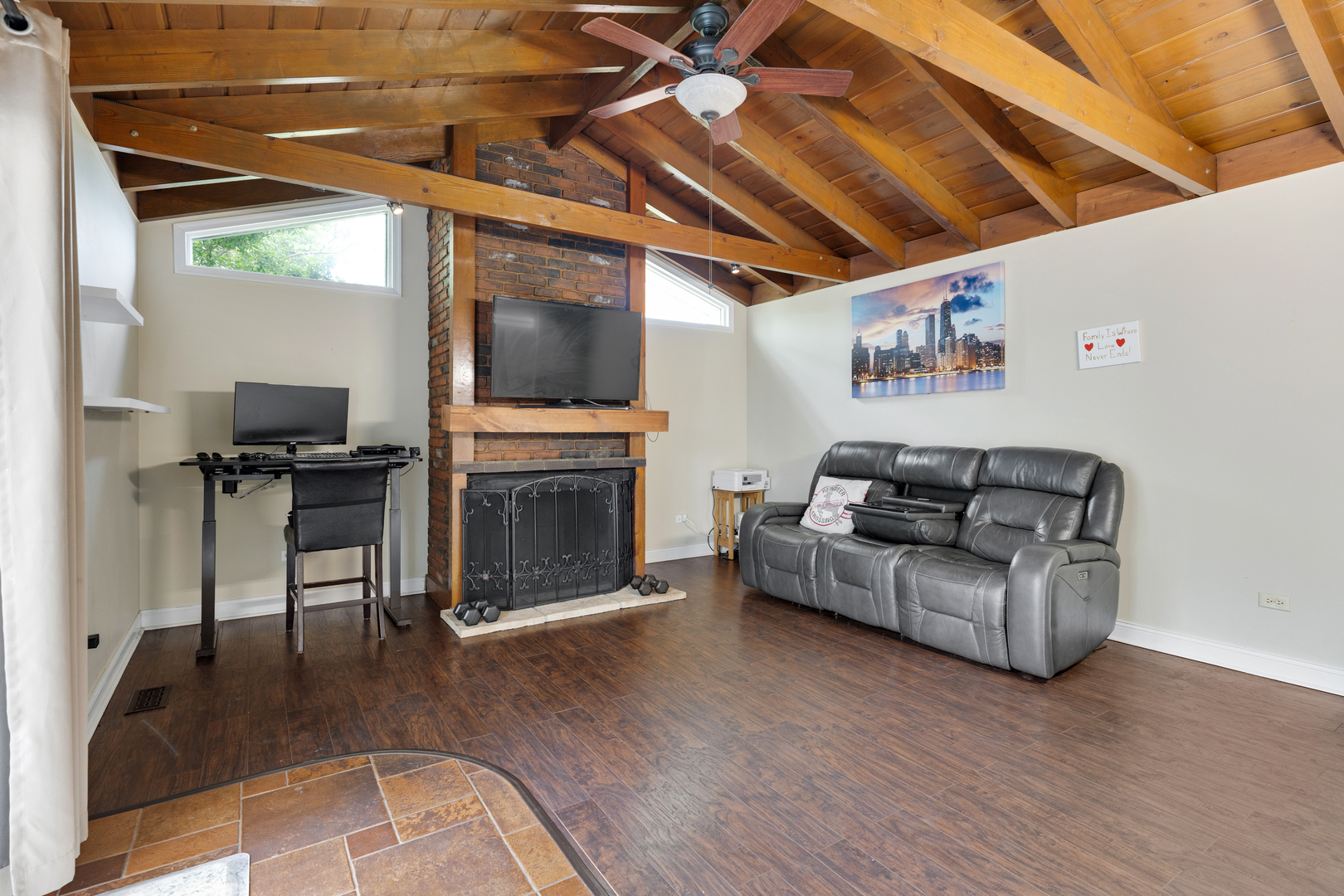 1850 Pierce Road Hoffman Estates, IL 60169 - Photo 9 of 25 a living room with furniture a flat screen tv and a fireplace