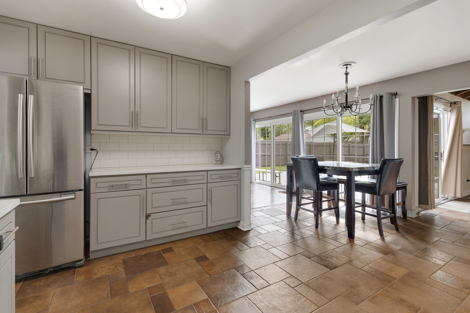 1850 Pierce Road Hoffman Estates, IL 60169 - Photo 10 of 25 a kitchen with stainless steel appliances granite countertop a refrigerator and a stove top oven