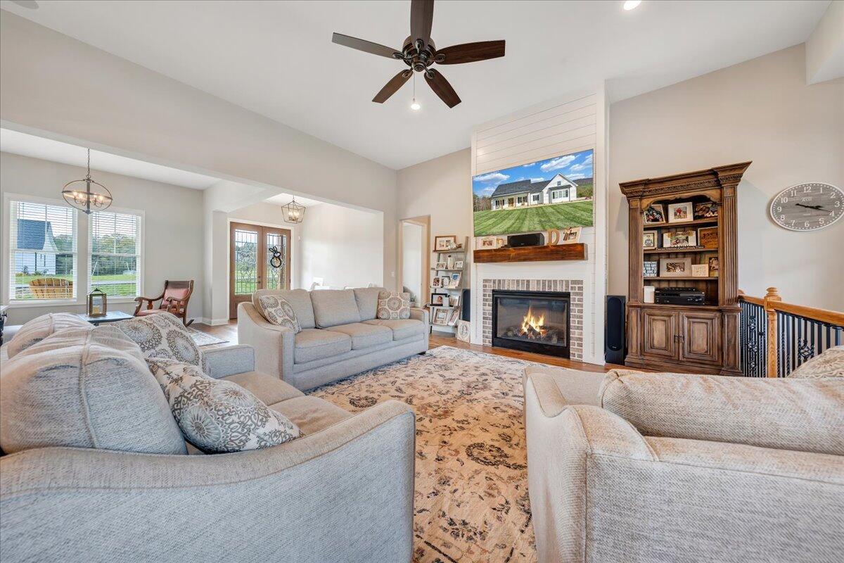198 Thornblade Way Blue Ridge, VA 24064 - Photo 10 of 78 a living room with furniture fireplace and a window