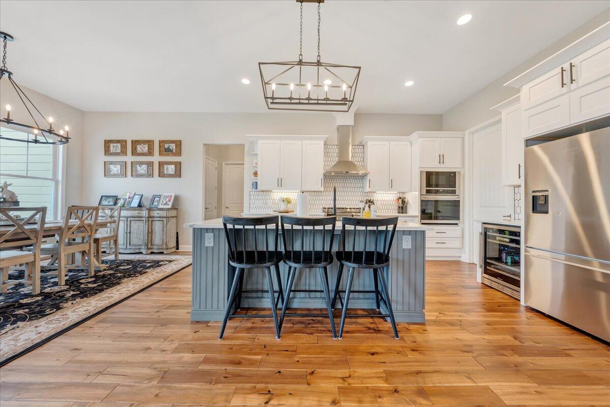 198 Thornblade Way Blue Ridge, VA 24064 - Photo 12 of 78 a view of a dining room with furniture kitchen and wooden floor