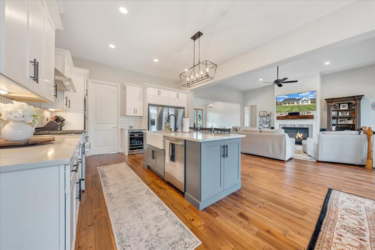198 Thornblade Way Blue Ridge, VA 24064 - Photo 17 of 78 a living room with stainless steel appliances kitchen island granite countertop furniture wooden floor and a kitchen view