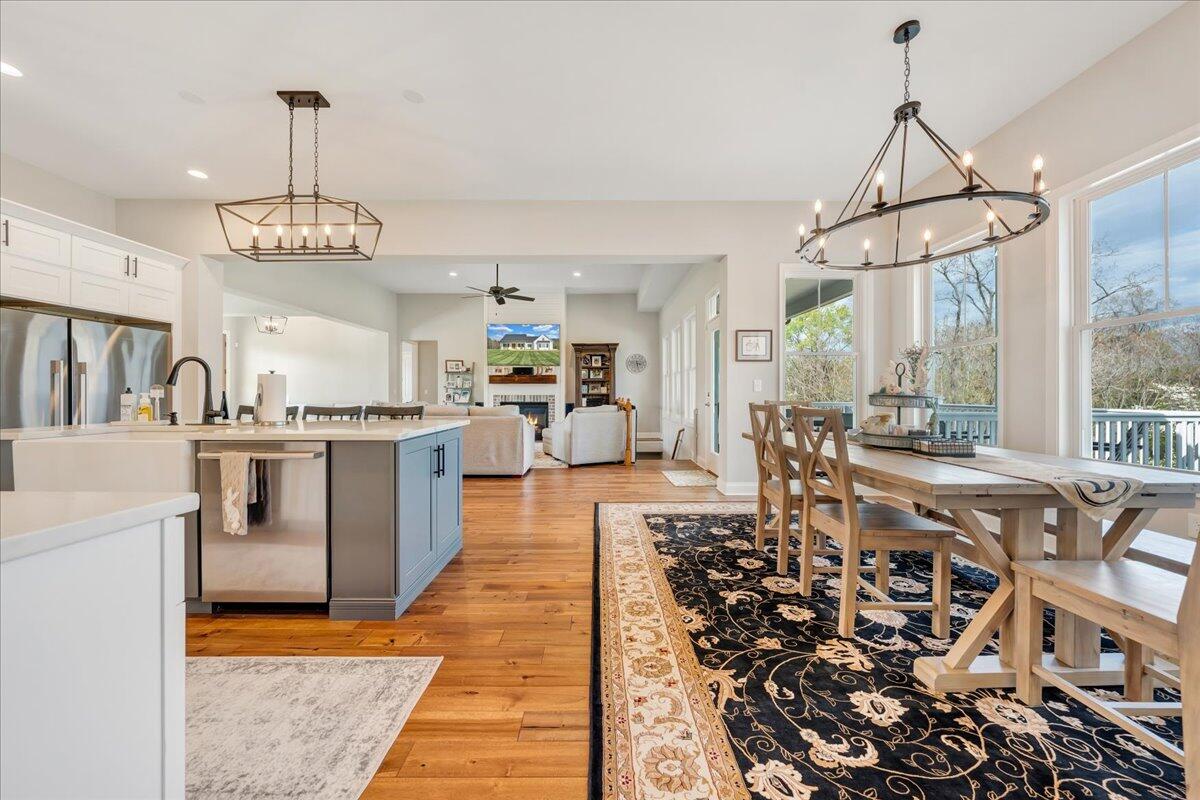198 Thornblade Way Blue Ridge, VA 24064 - Photo 27 of 78 a view of a dining room and livingroom with furniture wooden floor a chandelier