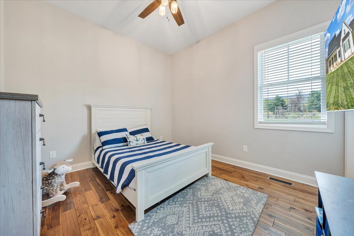 198 Thornblade Way Blue Ridge, VA 24064 - Photo 28 of 78 a bedroom with a bed and a window