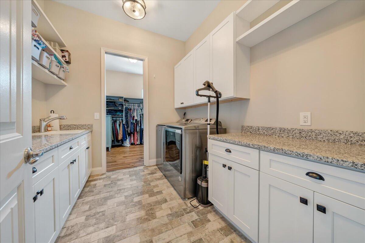 198 Thornblade Way Blue Ridge, VA 24064 - Photo 33 of 78 a spacious bathroom with a granite countertop sink and a mirror