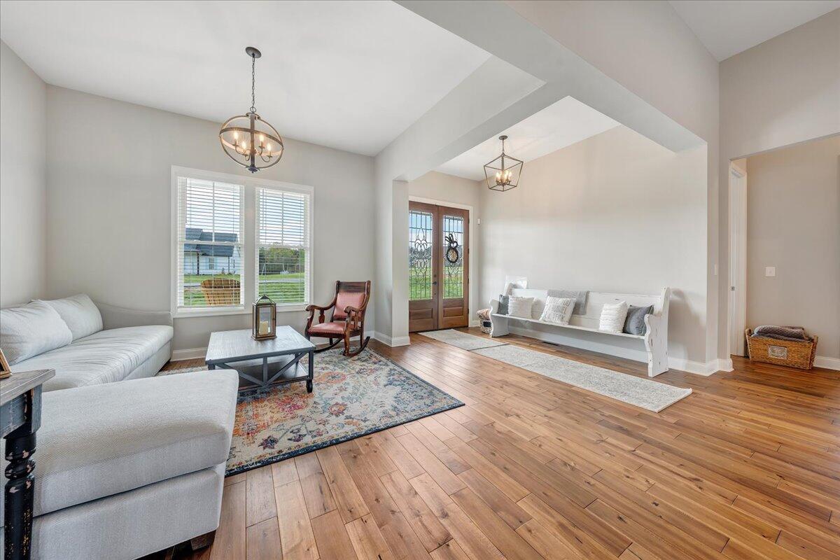 198 Thornblade Way Blue Ridge, VA 24064 - Photo 4 of 78 a living room with furniture wooden floor and a large window