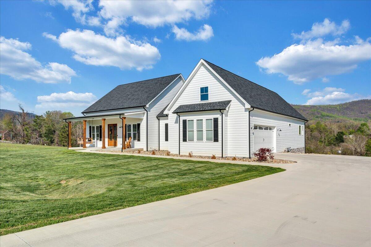 198 Thornblade Way Blue Ridge, VA 24064 - Photo 61 of 78 a front view of a house with a garden