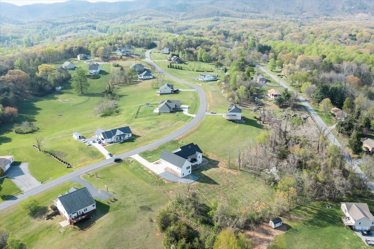 198 Thornblade Way Blue Ridge, VA 24064 - Photo 69 of 78 an aerial view of a house with a yard