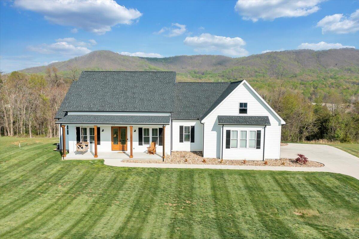 198 Thornblade Way Blue Ridge, VA 24064 - Photo 75 of 78 a front view of a house with garden
