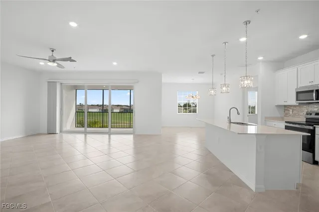 a view of a kitchen with a sink and microwave