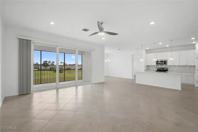 a view of a kitchen with a sink and a stove top oven