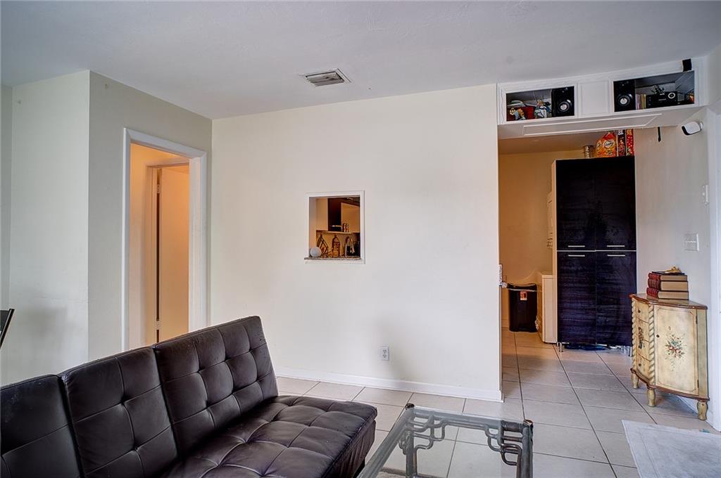 3860 Northeast 23rd Avenue Lighthouse Point, FL 33064 - Photo 19 of 33 a living room with furniture and a window