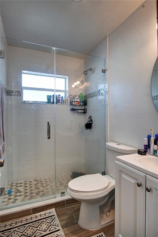 3860 Northeast 23rd Avenue Lighthouse Point, FL 33064 - Photo 24 of 33 a bathroom with a toilet a sink and shower