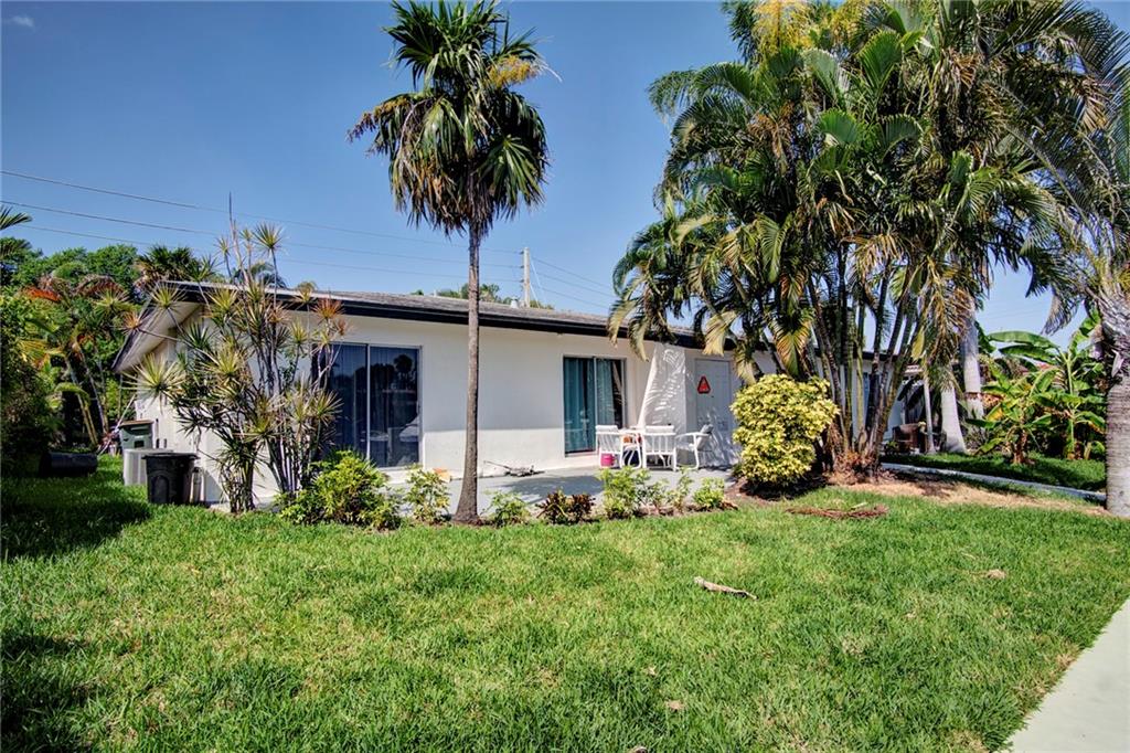 3860 Northeast 23rd Avenue Lighthouse Point, FL 33064 - Photo 30 of 33 a front view of a house with garden