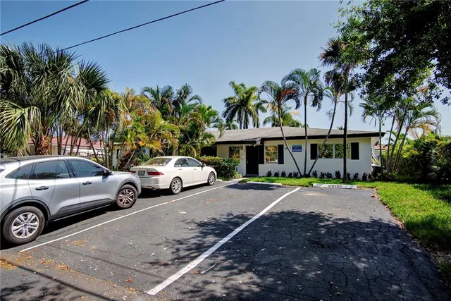 a balcony with chairs and table