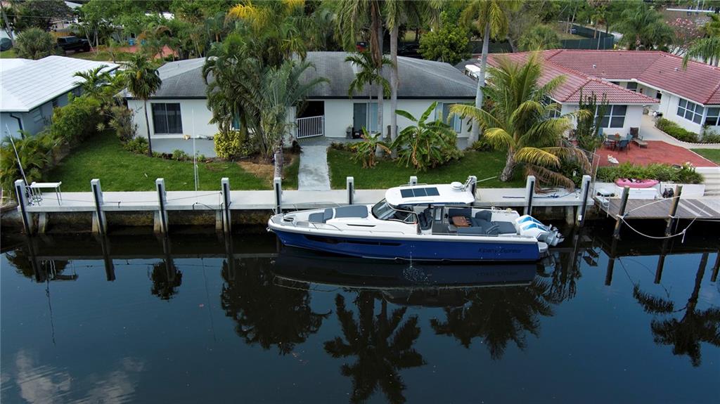 3860 Northeast 23rd Avenue Lighthouse Point, FL 33064 - Photo 32 of 33 a view of house with outdoor seating space