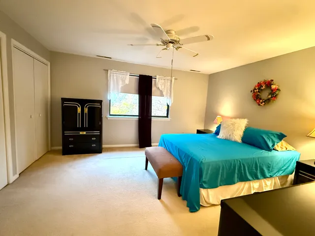 a bedroom with furniture and a chandelier