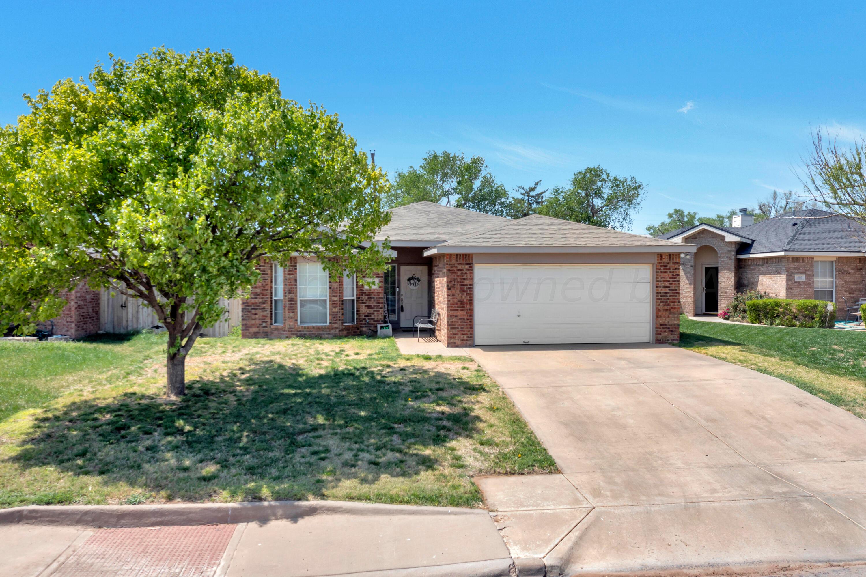 4902 Capulin Lane Amarillo, TX 79110 - Photo 2 of 25 front view of a house with a yard