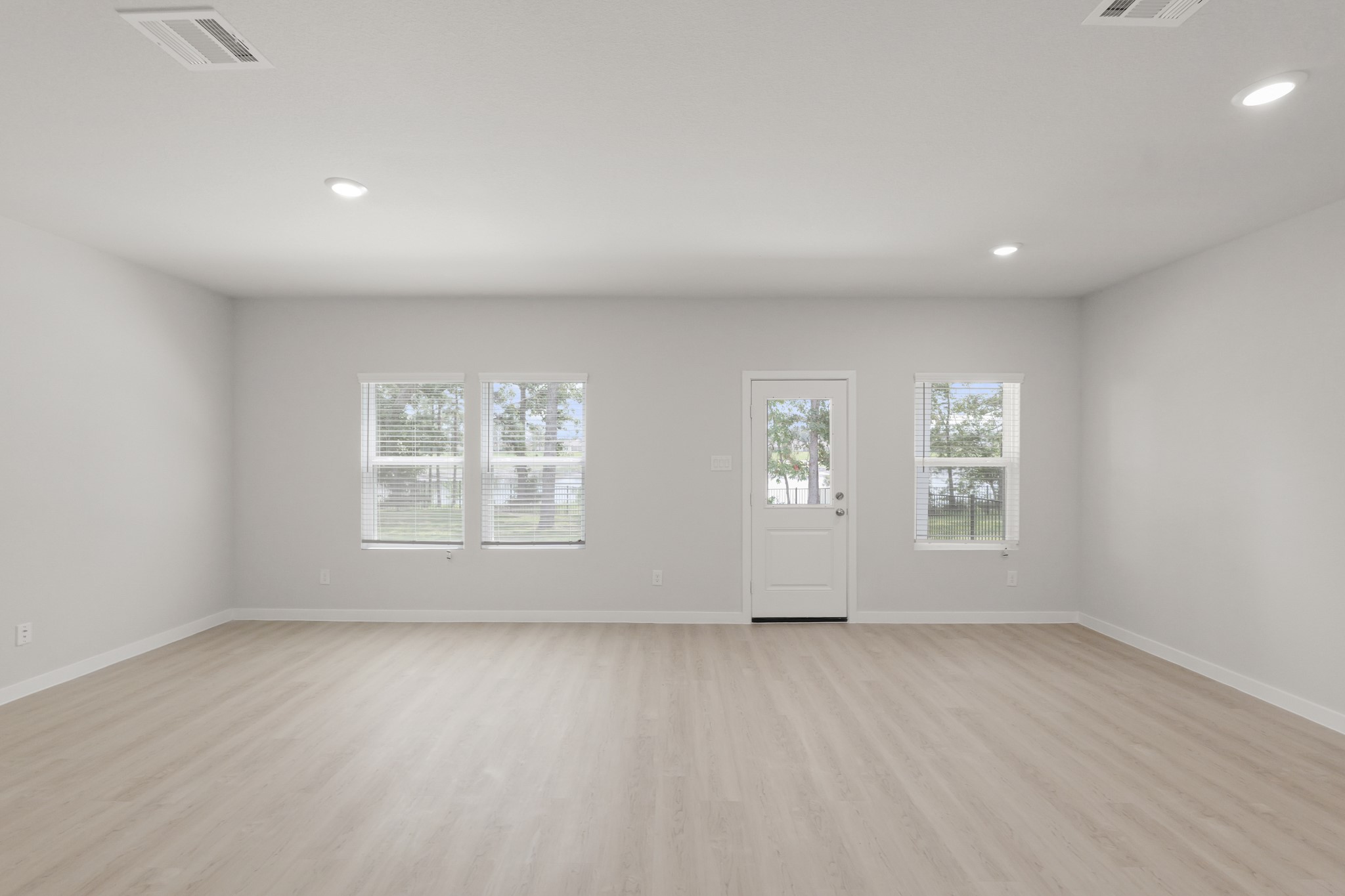 4414 Albritton Avenue Bryan, TX 77845 - Photo 9 of 34 an empty room with wooden floor and windows