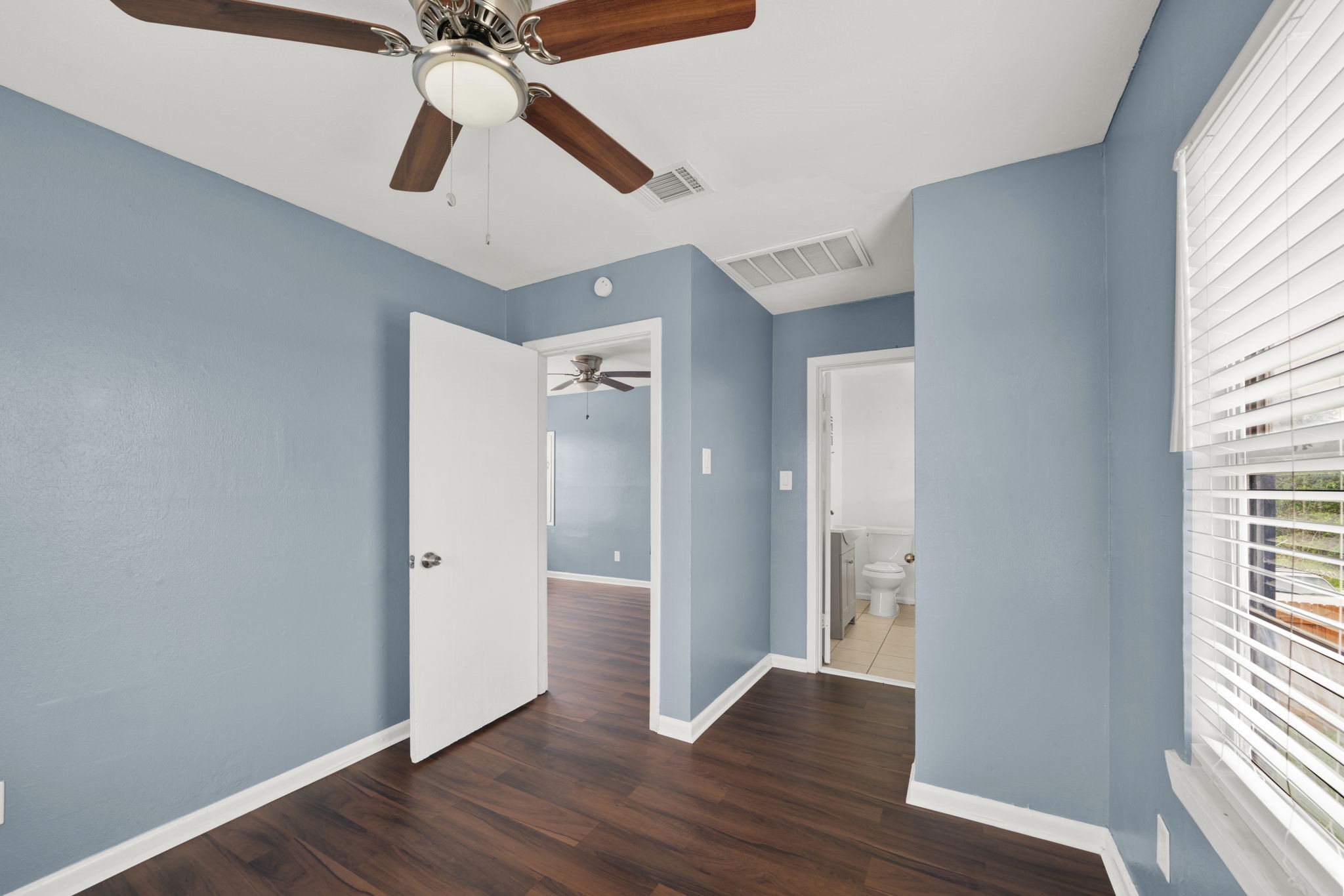904 Beverly Avenue, Unit 6 Pasadena, TX 77506 - Photo 25 of 32 a view of an empty room with wooden floor and a window