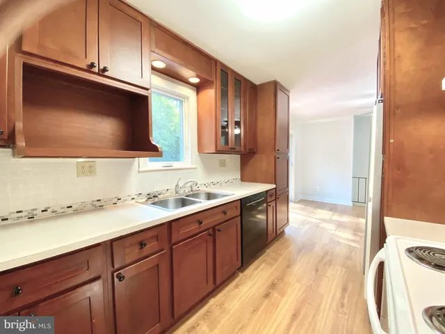 a bathroom with a sink a large mirror and a bathtub