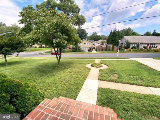 a view of swimming pool with a yard