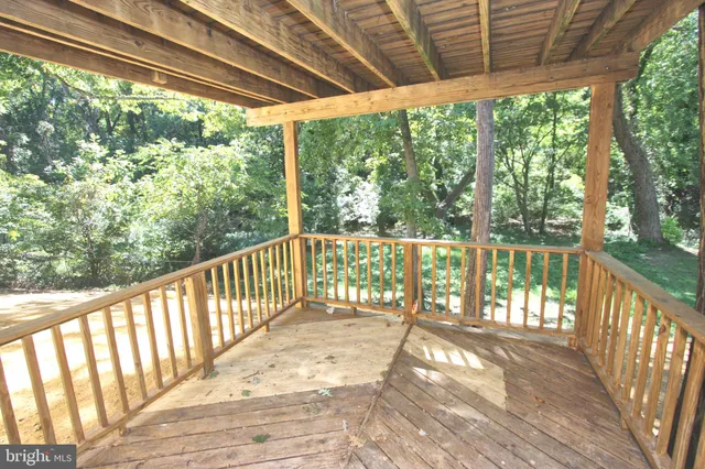 a view of balcony with wooden floor