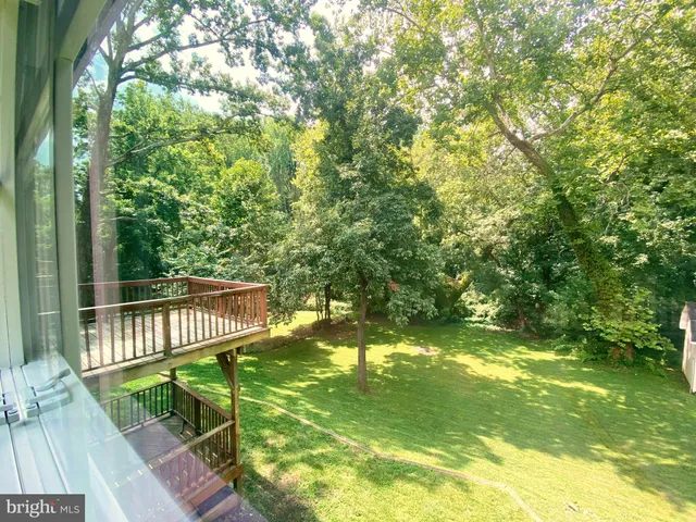 a view of a yard with swimming pool