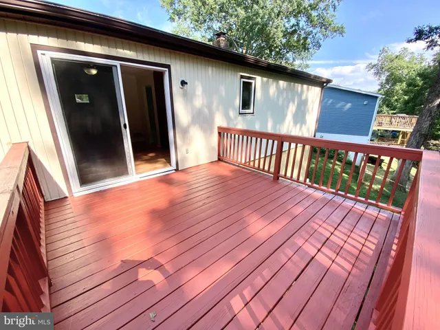 a balcony view with a wooden floor