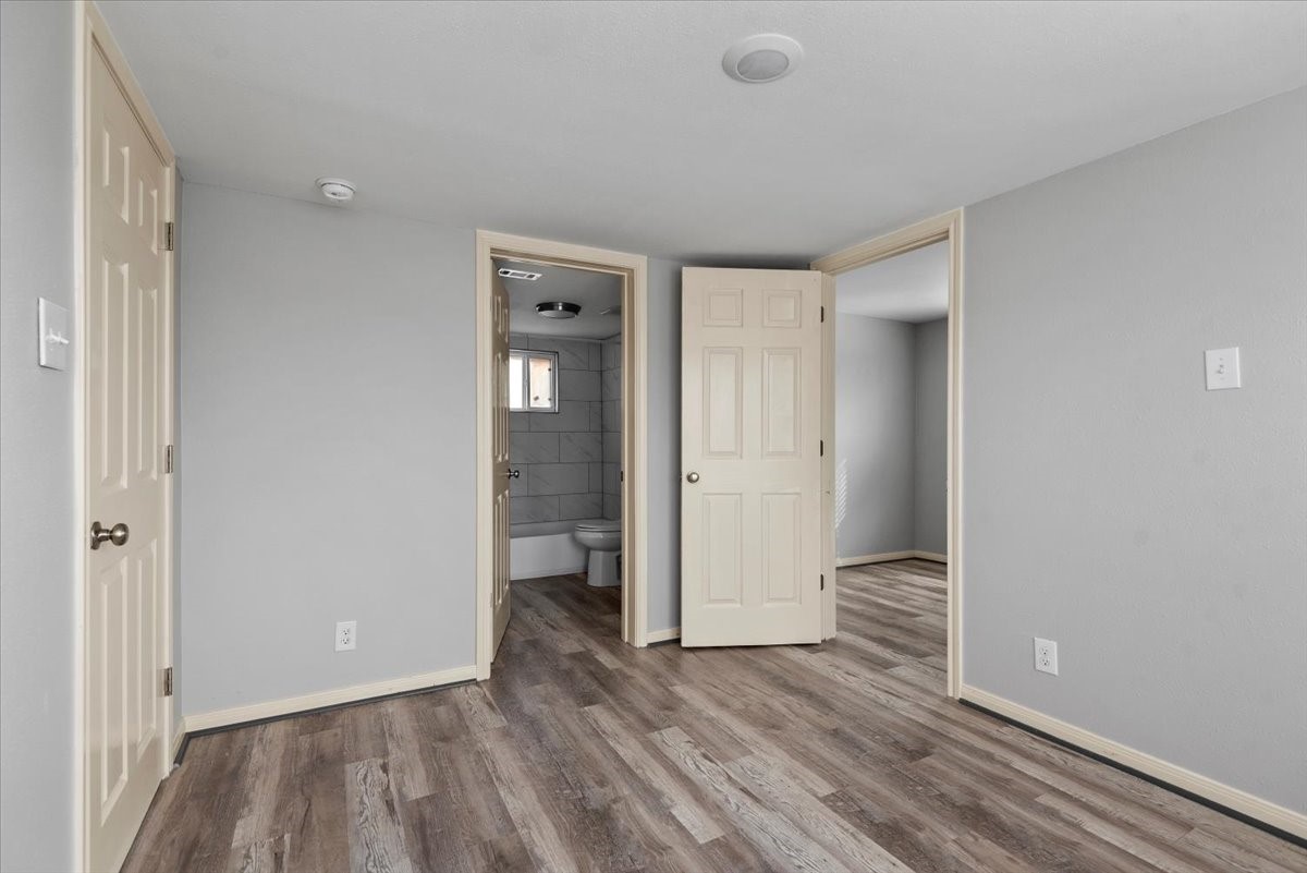 7413 Dallas Street Houston, TX 77011 - Photo 17 of 26 a view of an empty room and wooden floor