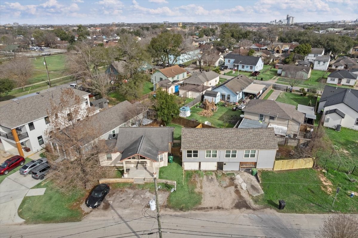 7413 Dallas Street Houston, TX 77011 - Photo 22 of 26 an aerial view of a house with a lake view