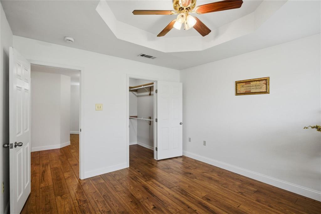 265 East Dove Road Southlake, TX 76092 - Photo 26 of 39 an empty room with wooden floor closet and windows