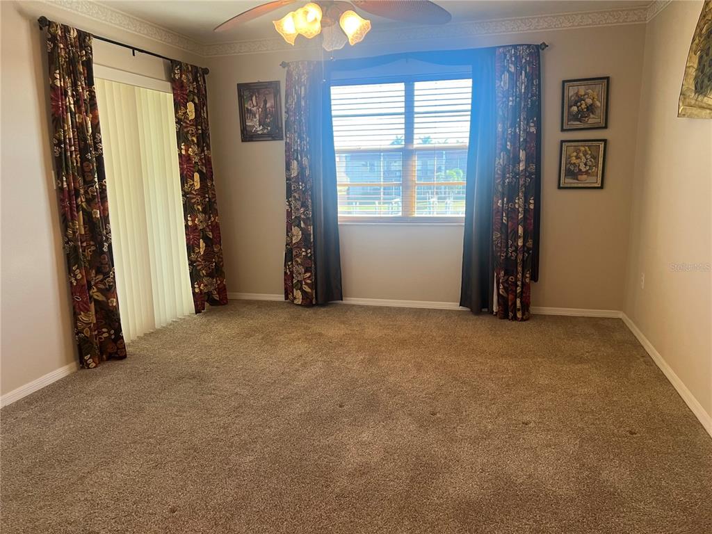 220 Coldeway Drive, Unit 123 Punta Gorda, FL 33950 - Photo 13 of 59 an empty room with windows and closet