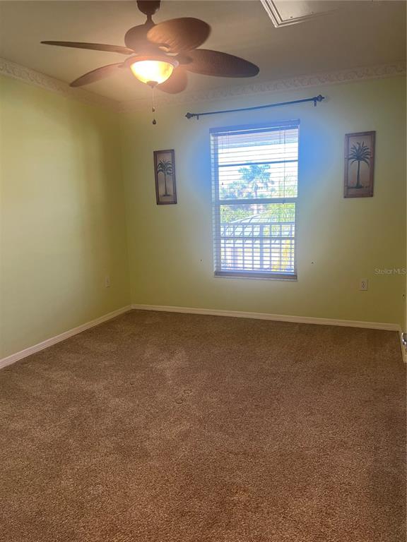 220 Coldeway Drive, Unit 123 Punta Gorda, FL 33950 - Photo 18 of 59 a view of an empty room with a window