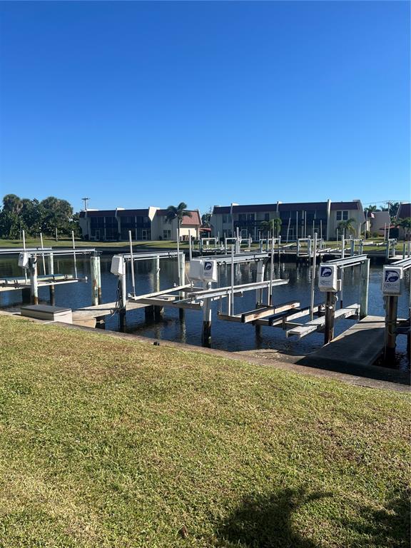 220 Coldeway Drive, Unit 123 Punta Gorda, FL 33950 - Photo 25 of 59 a view of a swimming pool with a lounge chair