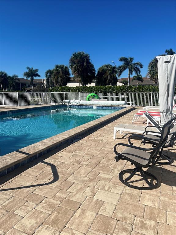 220 Coldeway Drive, Unit 123 Punta Gorda, FL 33950 - Photo 26 of 59 a view of a swimming pool with chairs