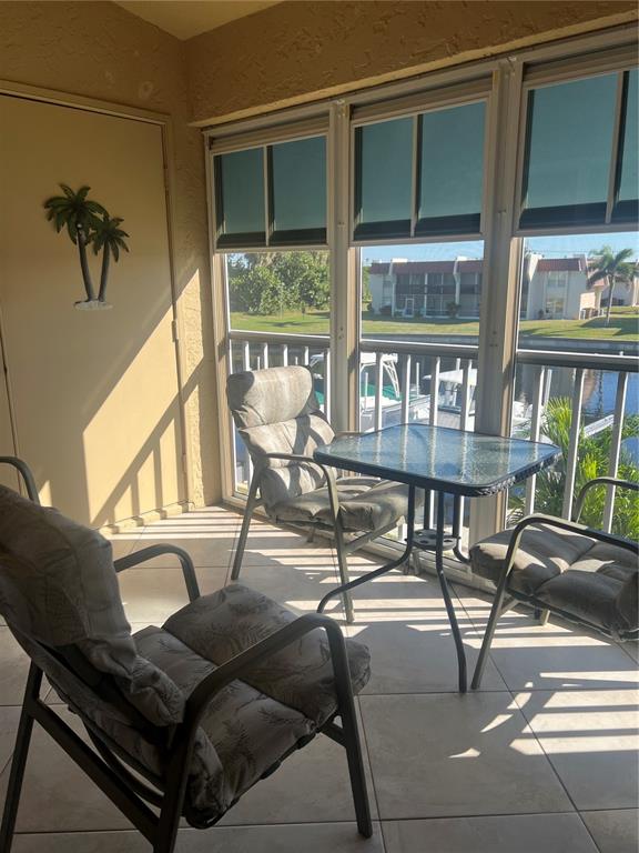 220 Coldeway Drive, Unit 123 Punta Gorda, FL 33950 - Photo 27 of 59 a living room with furniture and a window