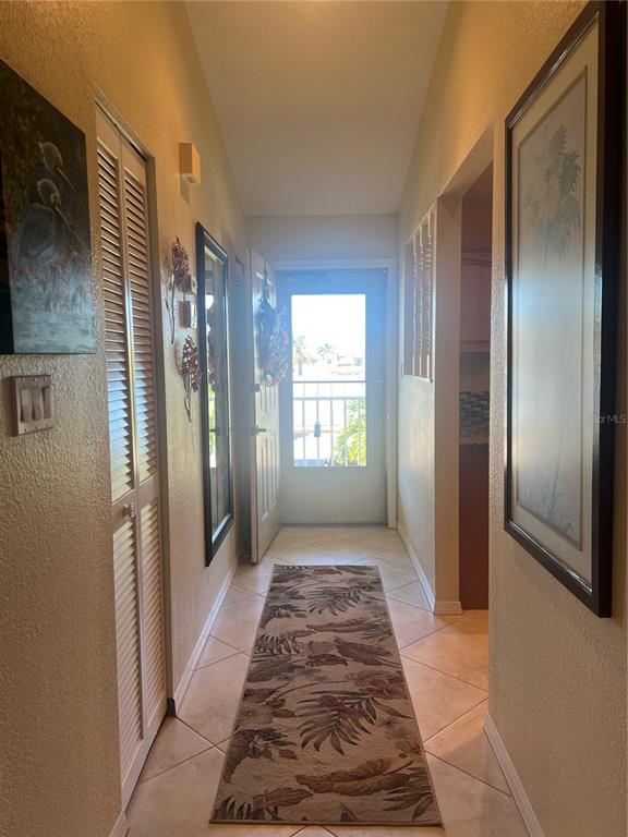 220 Coldeway Drive, Unit 123 Punta Gorda, FL 33950 - Photo 3 of 59 a view of a hallway with windows