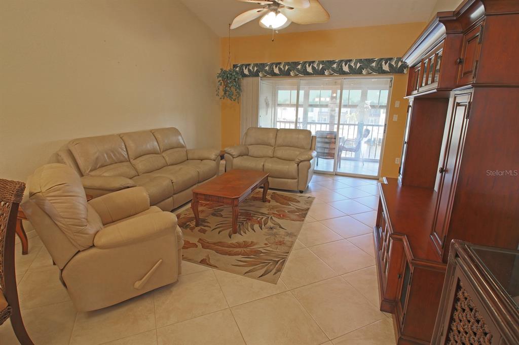 220 Coldeway Drive, Unit 123 Punta Gorda, FL 33950 - Photo 41 of 59 a living room with furniture and a window