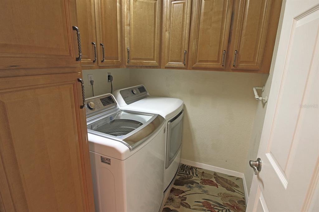 220 Coldeway Drive, Unit 123 Punta Gorda, FL 33950 - Photo 48 of 59 a utility room with dryer and washer