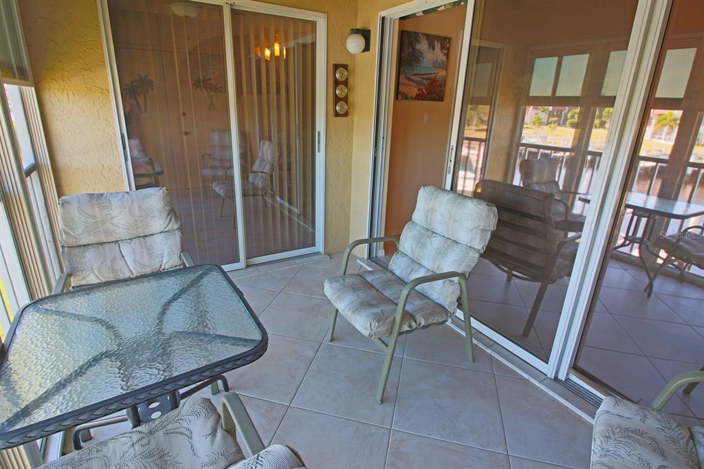 220 Coldeway Drive, Unit 123 Punta Gorda, FL 33950 - Photo 50 of 59 a living room with furniture and a rug