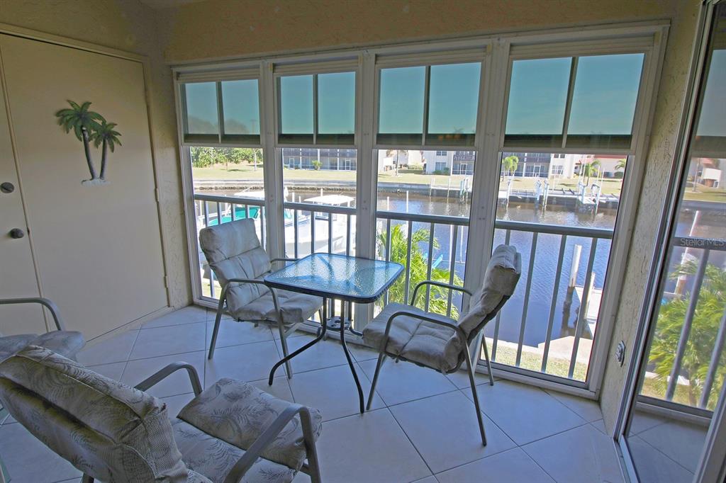 220 Coldeway Drive, Unit 123 Punta Gorda, FL 33950 - Photo 51 of 59 a view of a dining room with furniture window and outside view